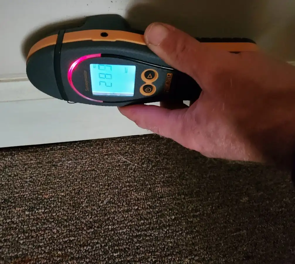 Moisture detection at baseboard during Storm Damage Restoration in Abilene